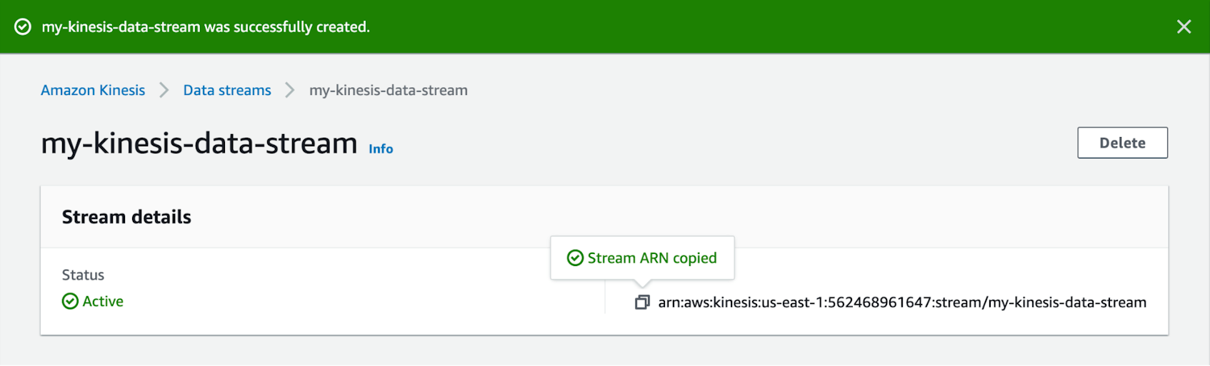 A Kinesis web page shows a banner stating that the stream was successfully created, and acknowledges that that stream's ARN has been copied to the user's clipboard.