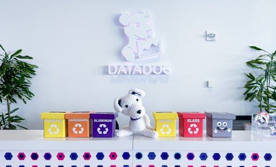 Photo of Bits mascot with recycling bins